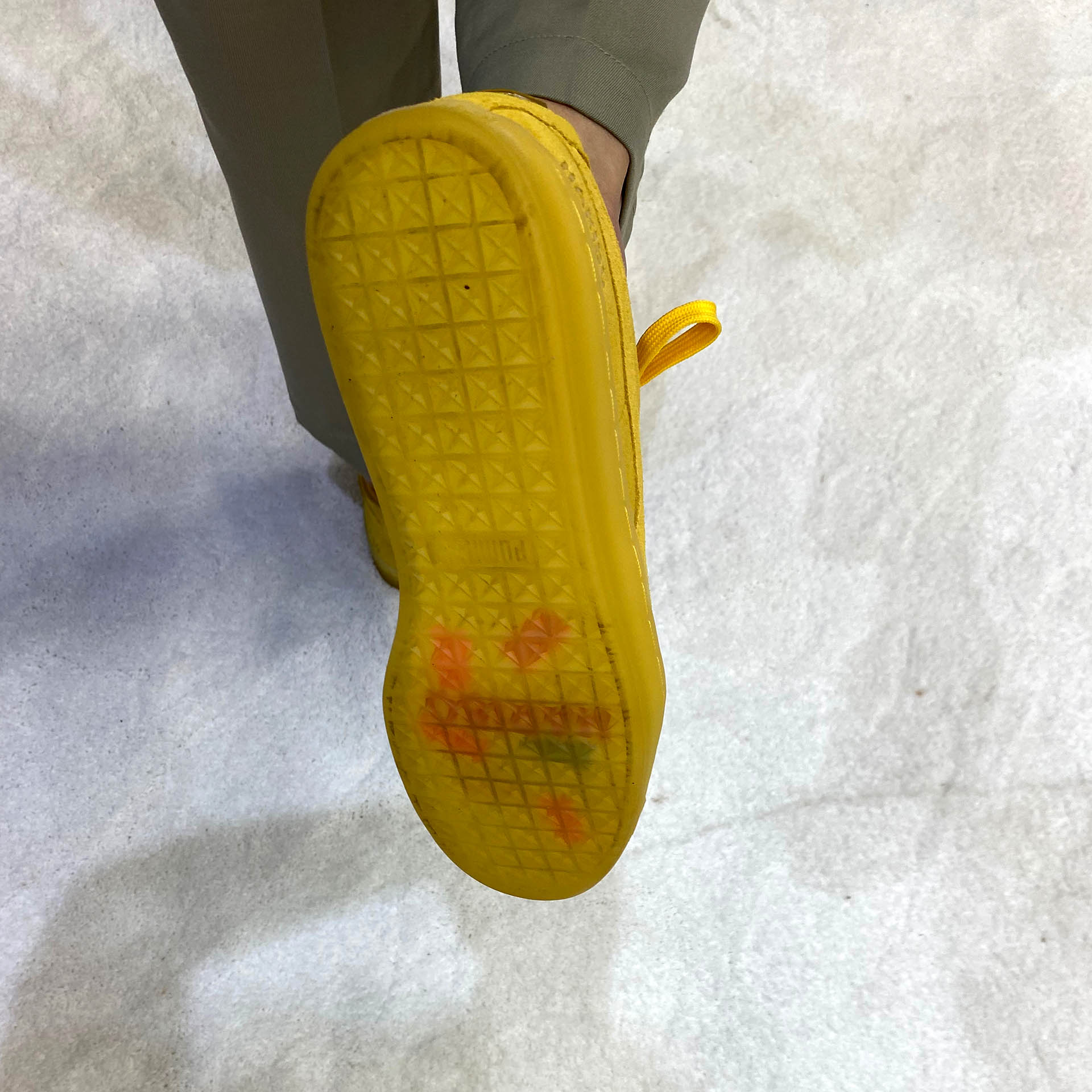 sole of Haribo sneakers, which appear to have gummy bears crushed into them