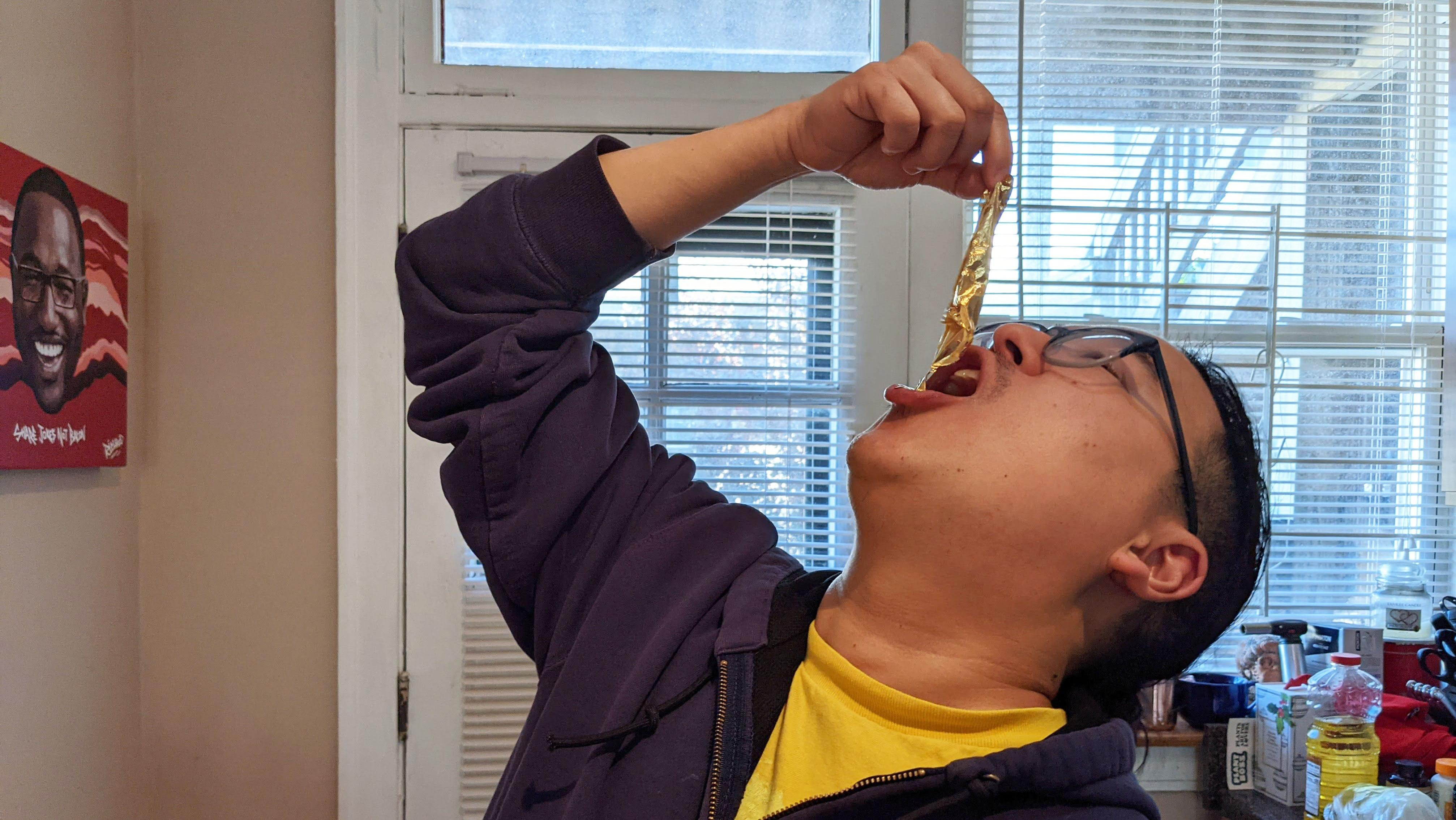 man eating gold leaf
