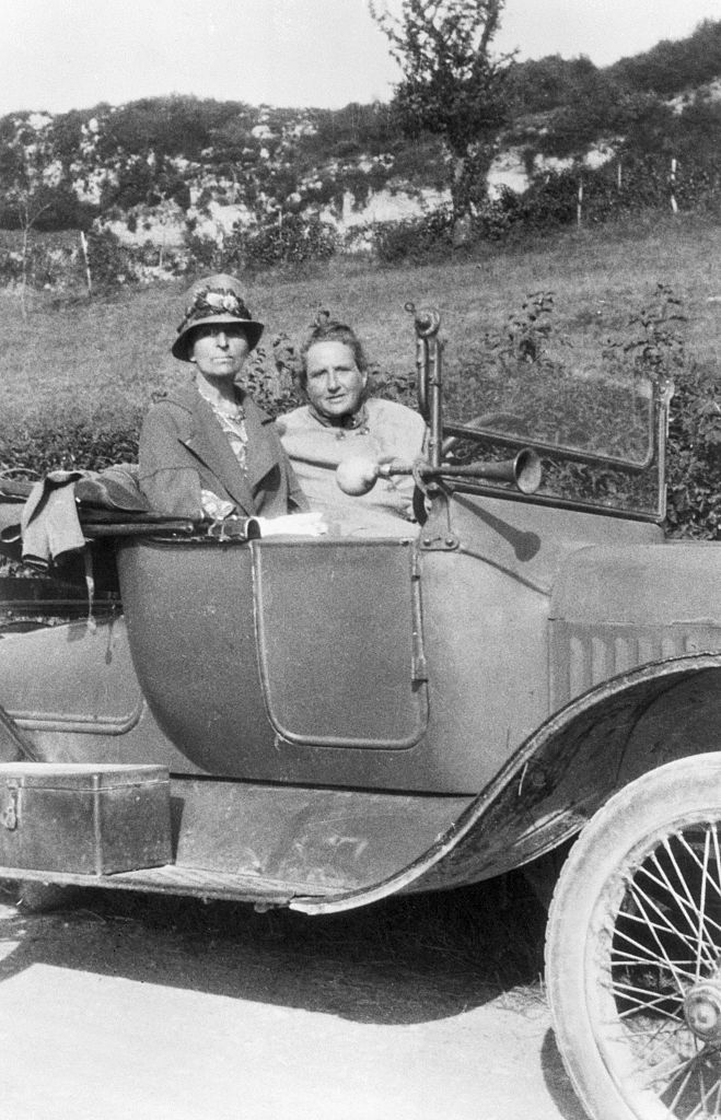 Alice B. Toklas and Gertrude Stein in open car