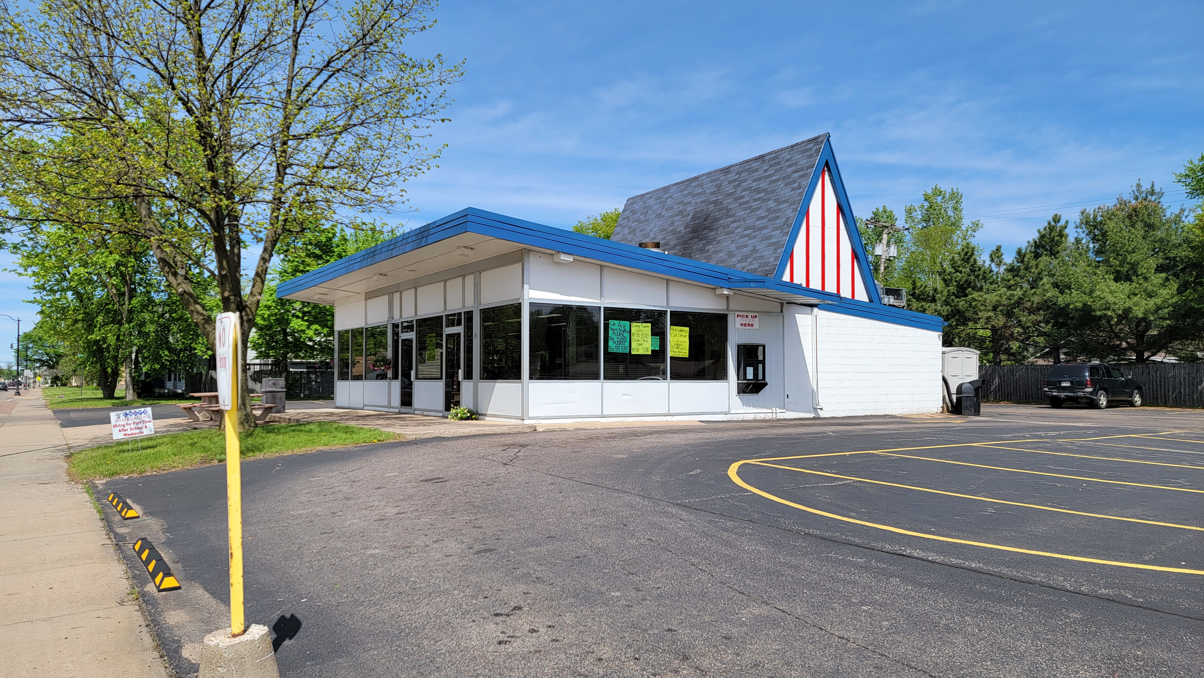 View of Chip's building from the parking lot, a small midcentury modern building