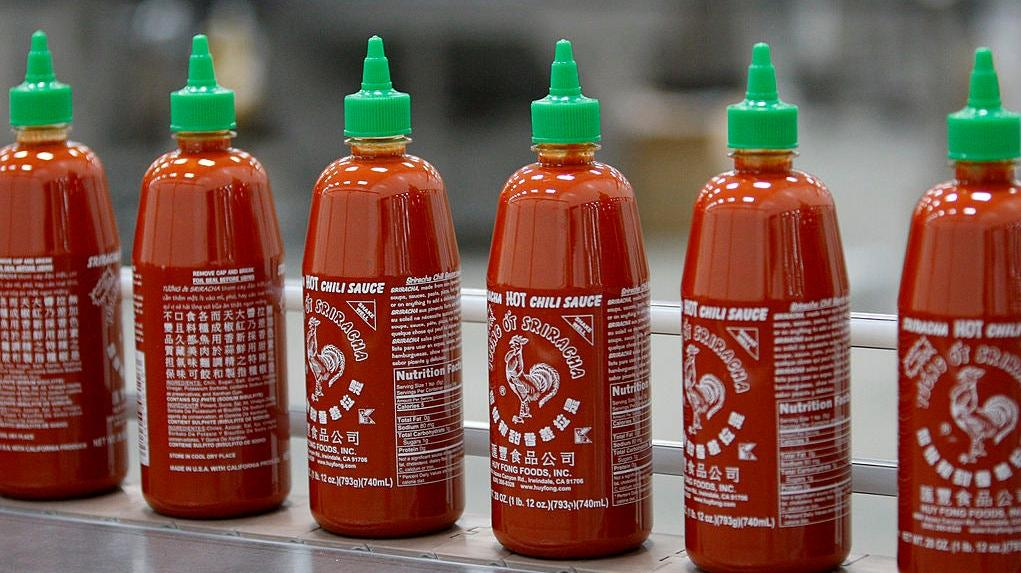 Huy Fong sriracha bottles with green caps