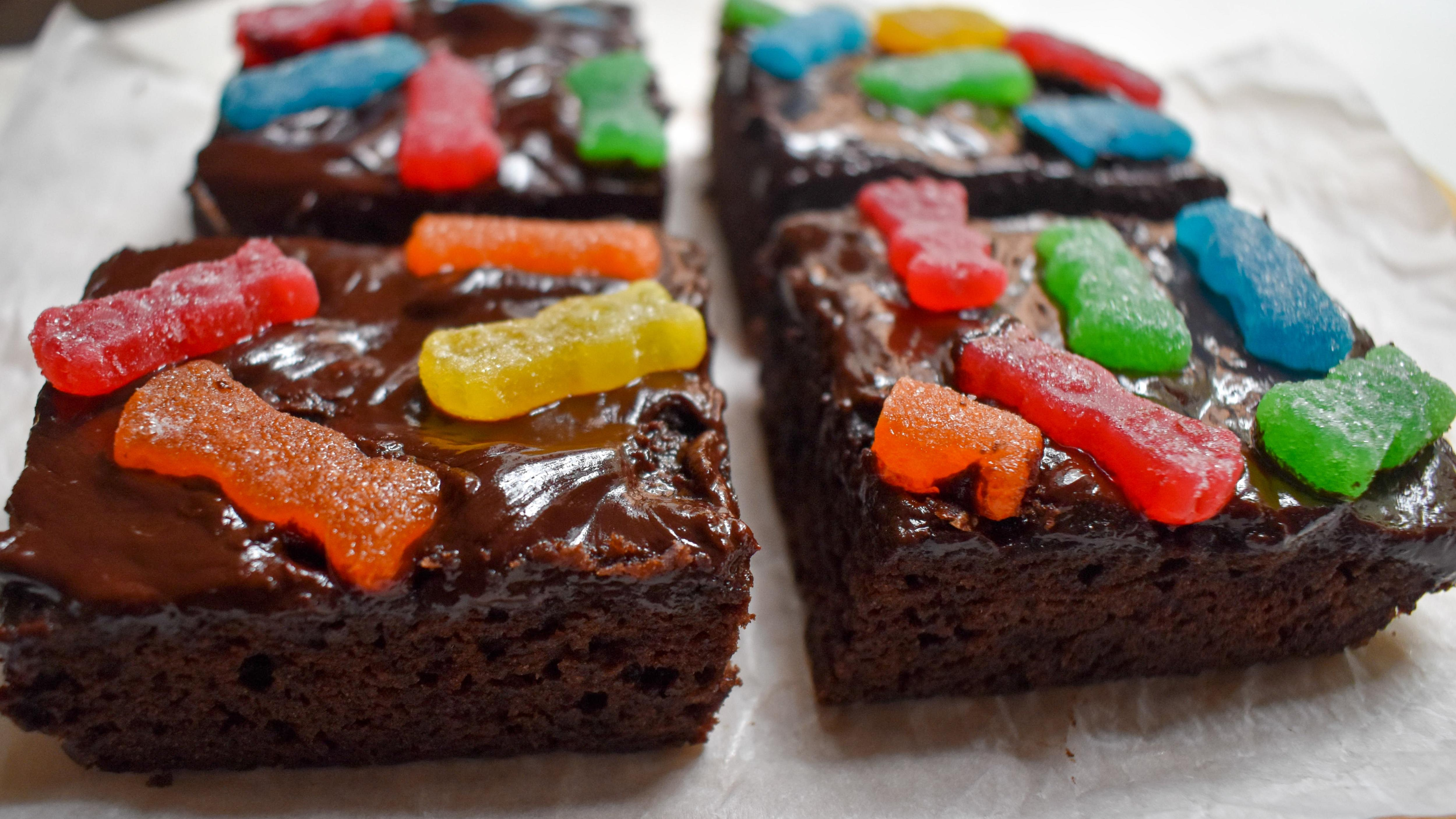 Close-up of Sour Patch Kids Brownies with chocolate ganache and candy on top