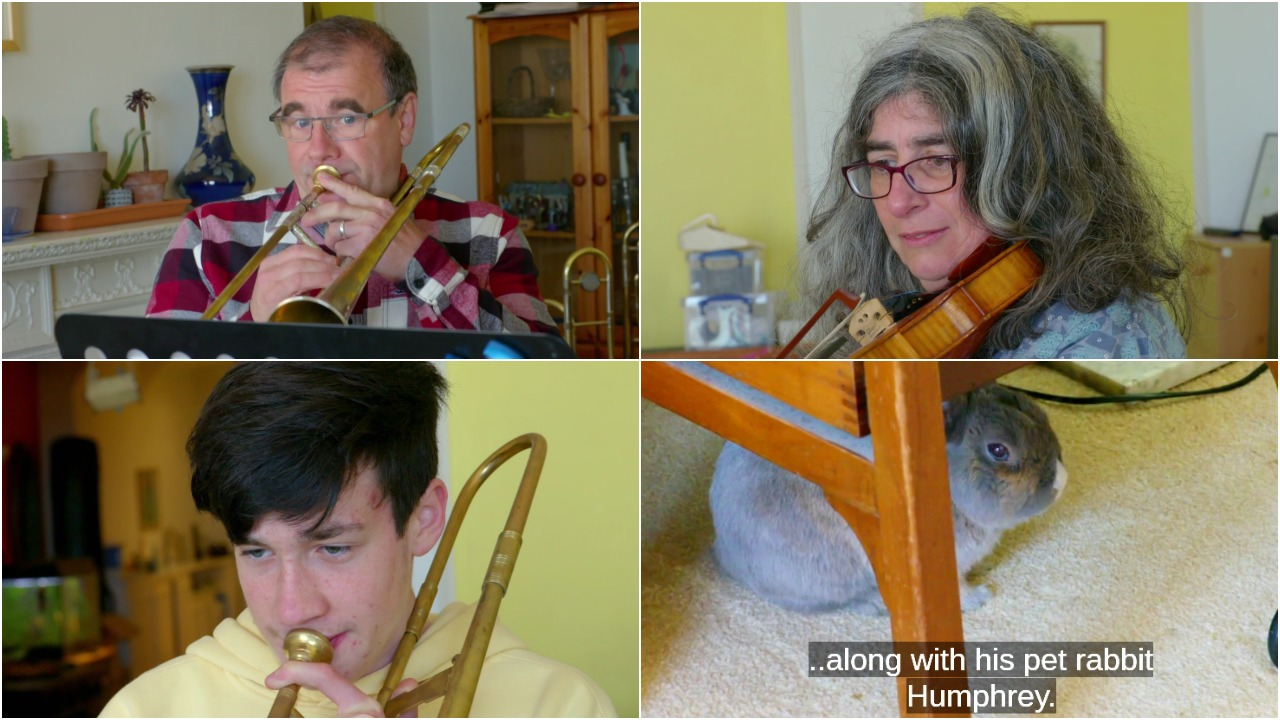 Jurgen and family playing instruments together as rabbit sits on floor