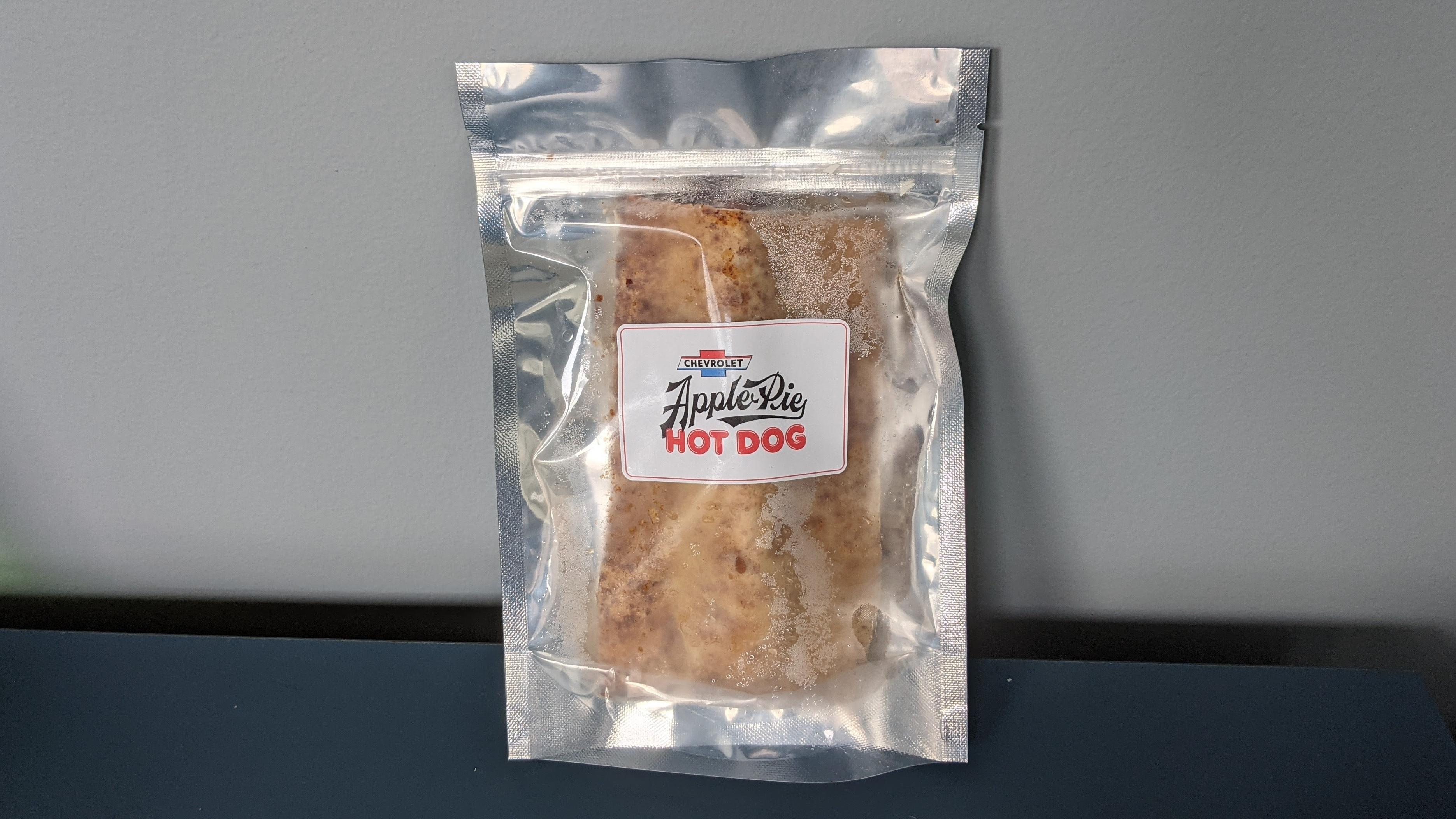 A plastic ziptop package containing a frozen Apple Pie Hot Dog