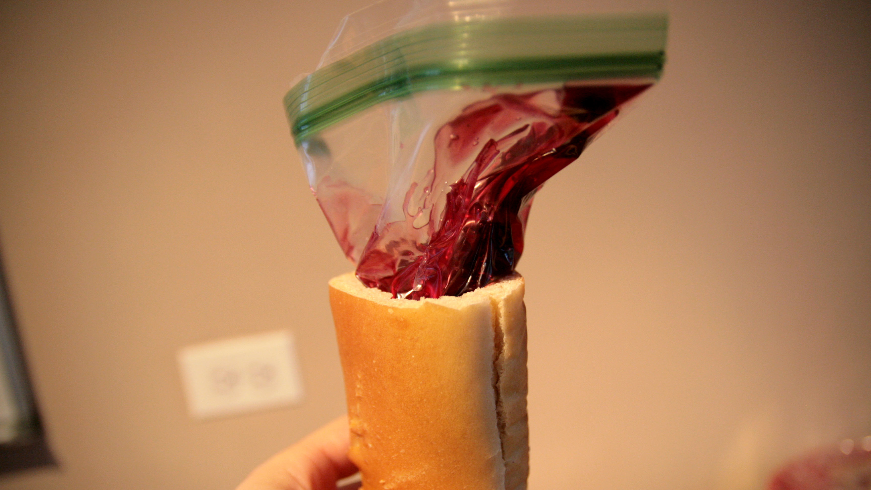 a ziploc bag filled with pie filling sticking out of a loaf of bread 