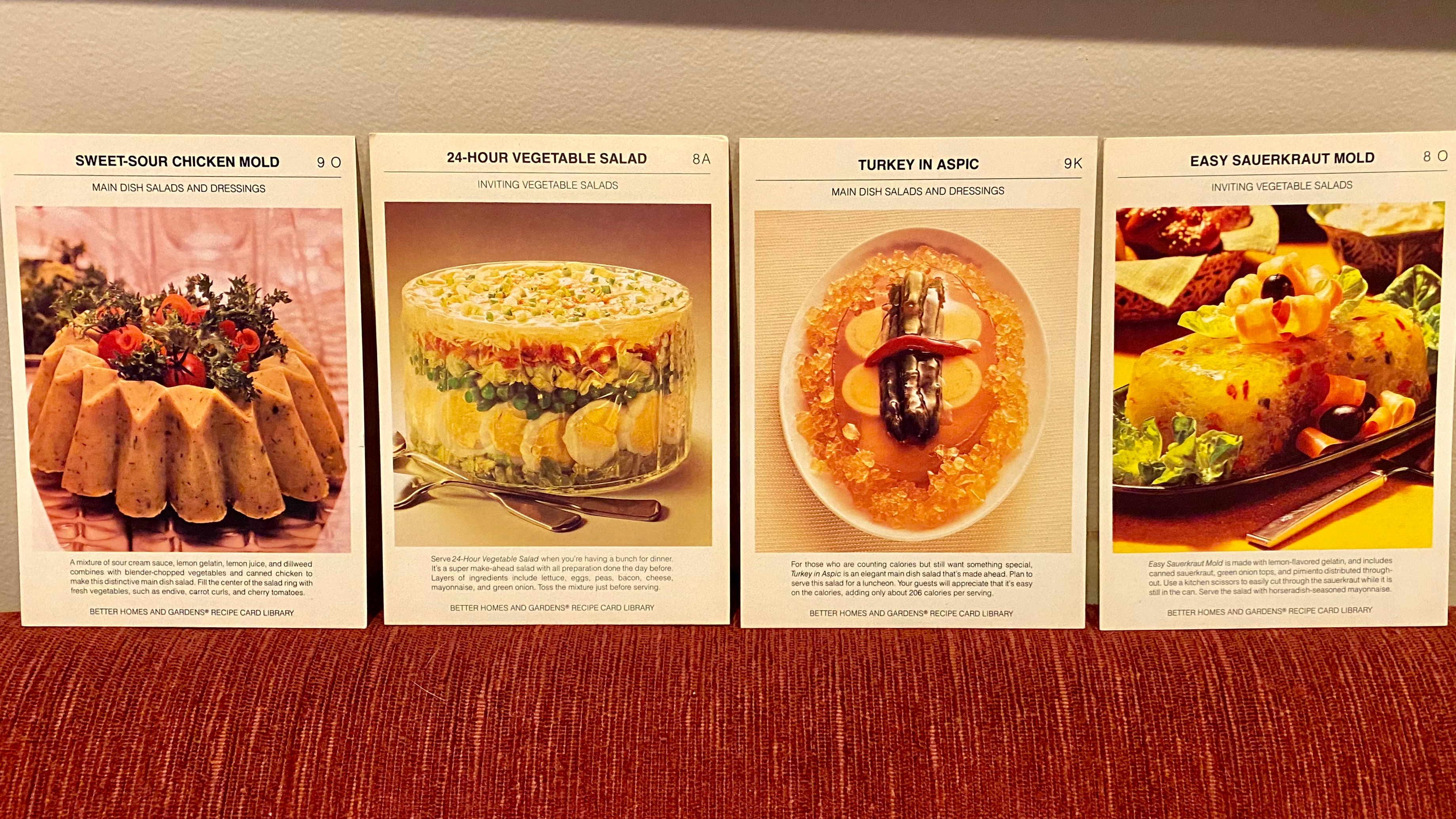 Four vintage recipe cards featuring aspics and other savory Jell-O molds