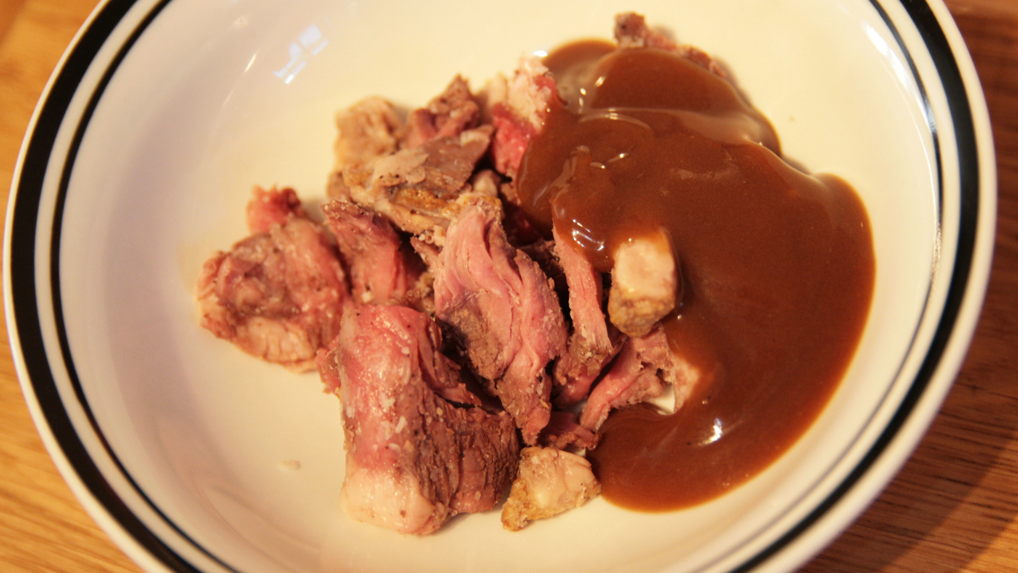 Steak and gravy in a microwave bowl