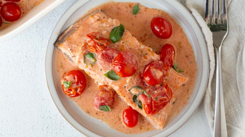 salmon filet with burst tomatoes