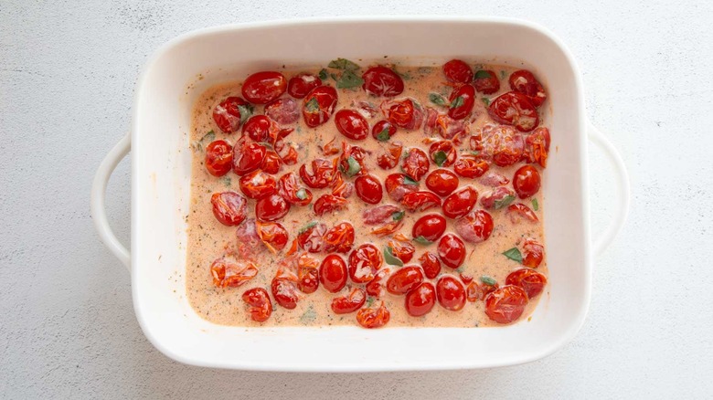 mashed tomatoes in a creamy sauce with basil