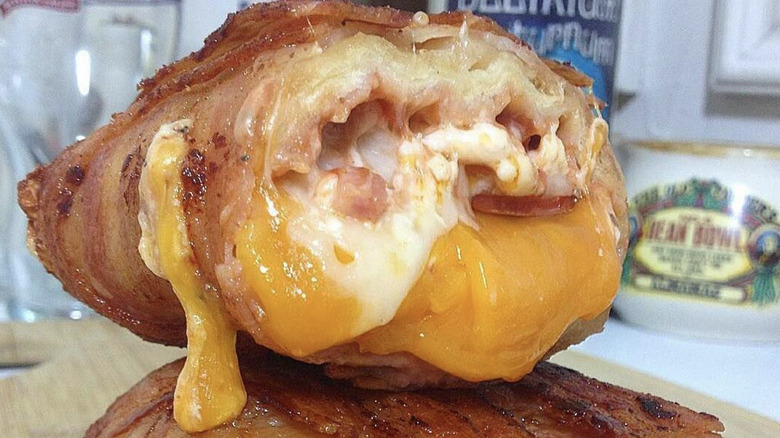 Bacon-wrapped burrito with melted cheese