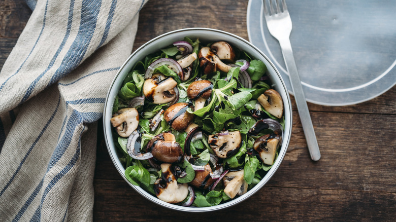 Mushrooms in a bowl with other vegetables