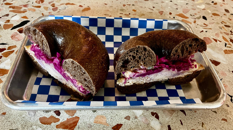 two pumpernickel bagel halves