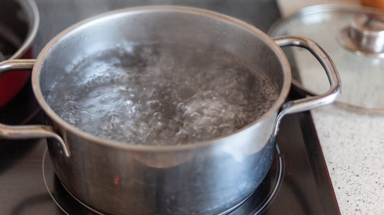 Hot water boiling in a metal pot