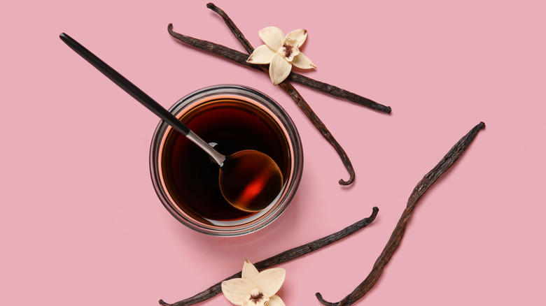 Vanilla essence in a bowl with a spoon