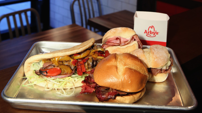 Tray of Arby's food, including varied sandwiches