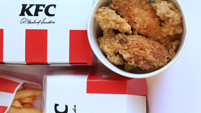 KFC food, including a bucket of chicken and some fries