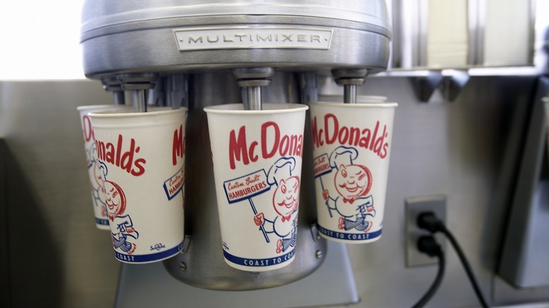 Vintage McDonald's milkshake mixer mixing five different cups of shakes