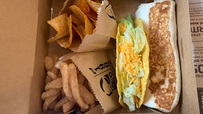 Taco Bell food, including nachos, a taco, a burrito, and cinnamon twists