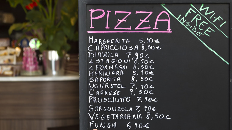 Pizza menu on a chalkboard