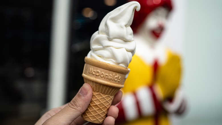 Hand holding McDonald's ice cream cone