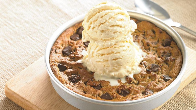 Baked cookie topped with ice cream