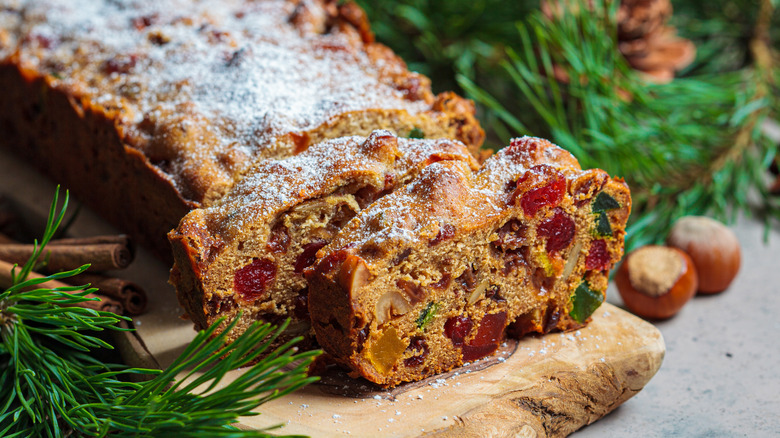 Fruitcake placed amid winter greenery