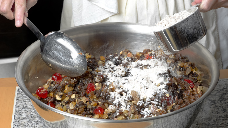 Mixing dried fruits in bowl