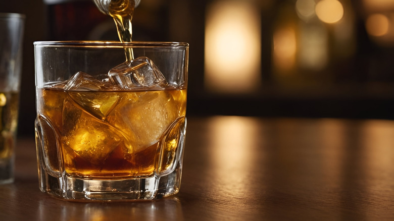 Whiskey being poured into a glass