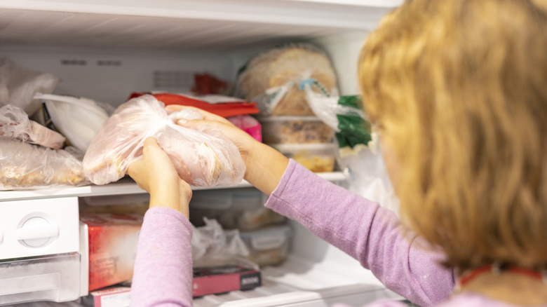 Person taking meat out of the freezer