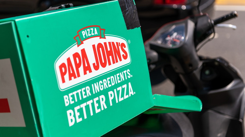 Papa Johns box on back of delivery bike