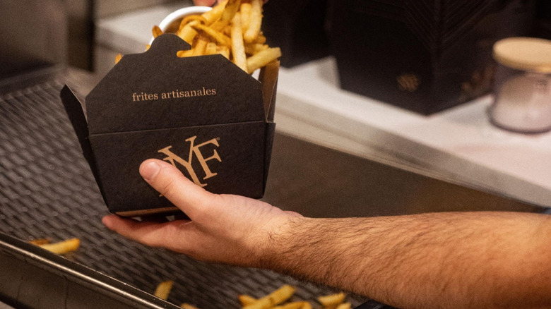 Close-up of New York Fries french fries being prepared