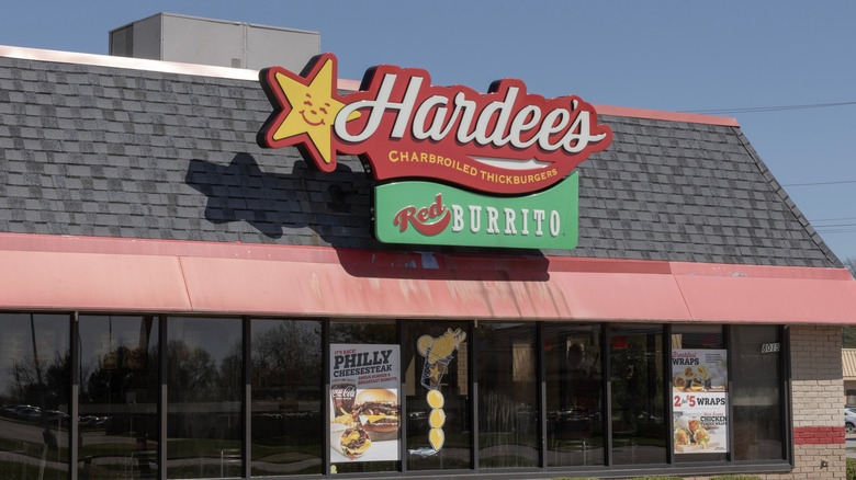 A Hardee's sign on the outside of a restaurant