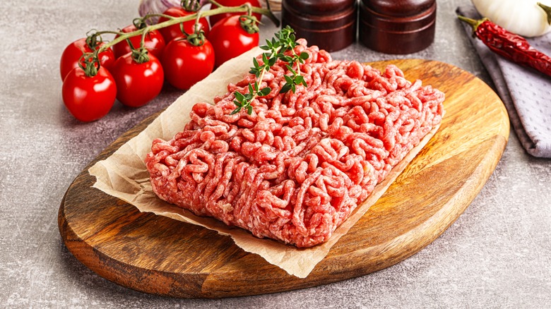 Ground beef on a wooden board