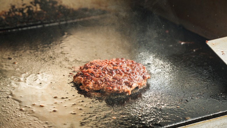 Smash burger patty on a griddle