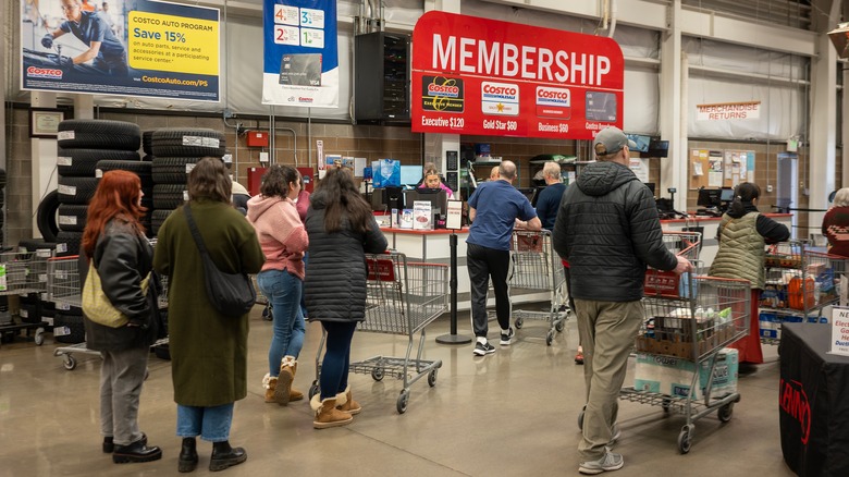 Crowd stands at Costco membership counter