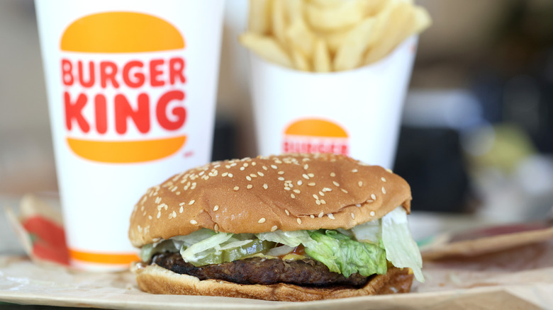 Burger King Whopper in front of drink and fries