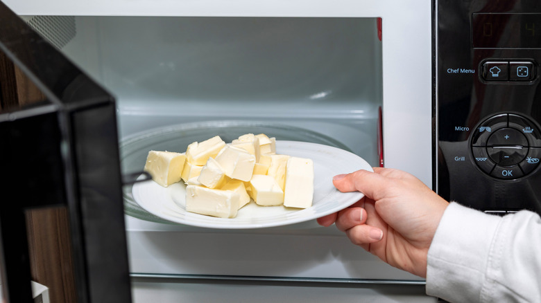 Placing butter on a plate in the microwave