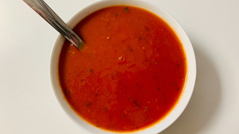 tomato soup in white bowl