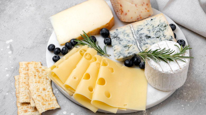 Assorted cheeses together on plate