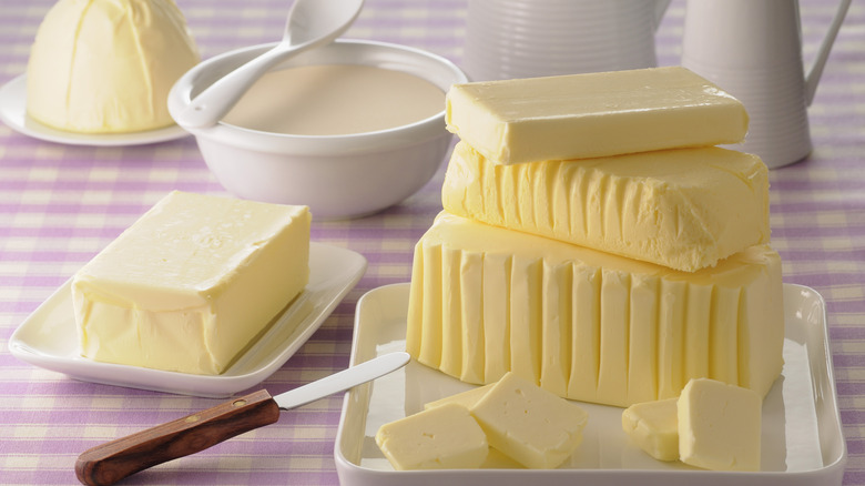 Different types of butter on a pink checkered cloth