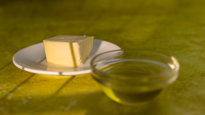 Butter and oil on a plain countertop