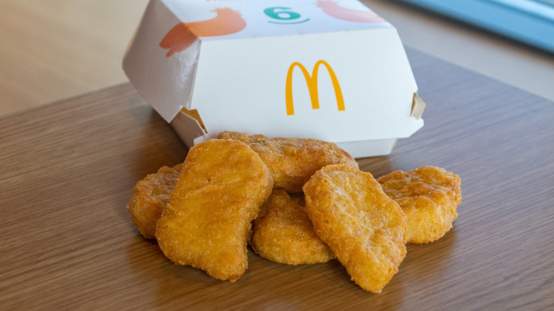 Chicken McNuggets next to a McDonald's food container