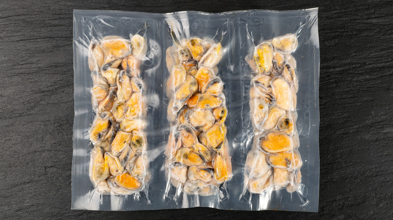 Three packages of frozen mussels