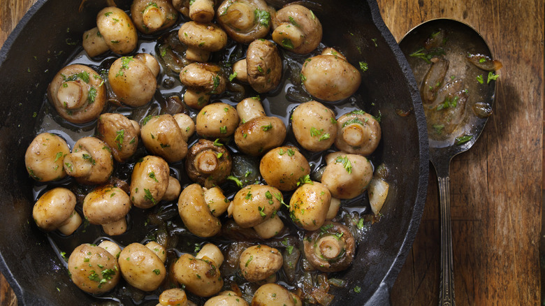 sauteed mushrooms in cast iron pan