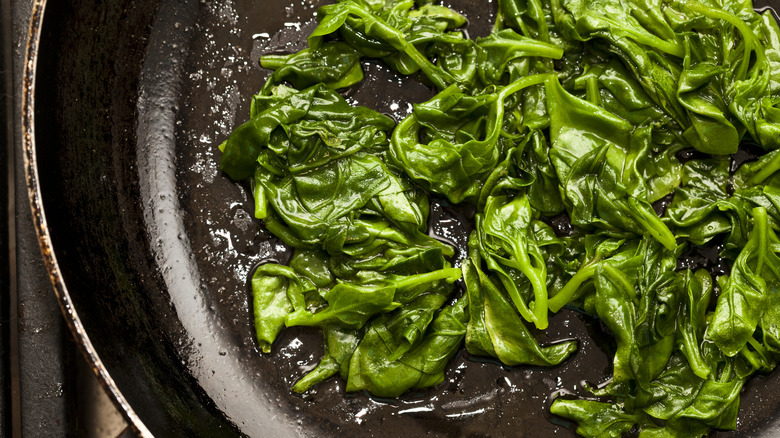 cooked spinach in a pan