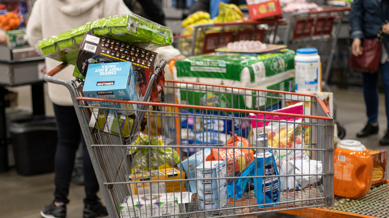 Costco shoppers cart in a checkout line