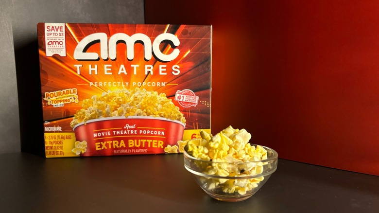 AMC Theatres box and popcorn in clear ramekin