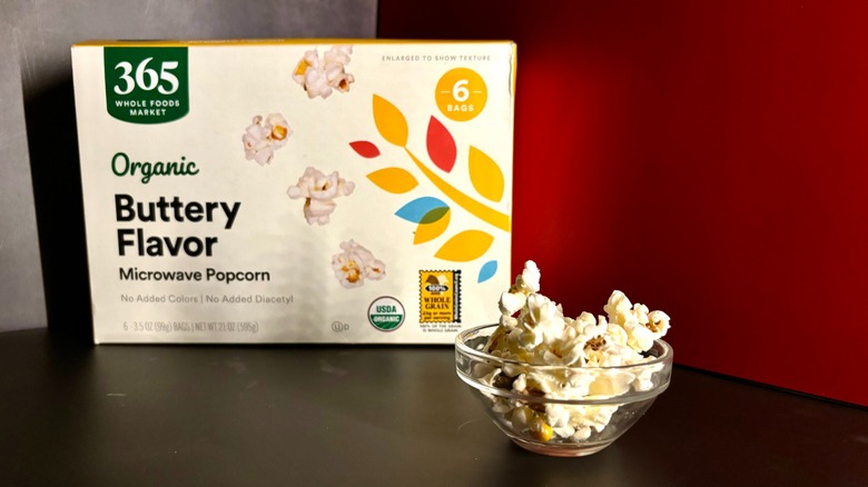 365 Whole Foods popcorn box and popcorn in clear ramekin