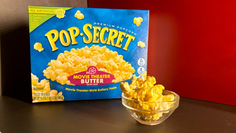 Pop Secret popcorn box and popcorn in clear ramekin