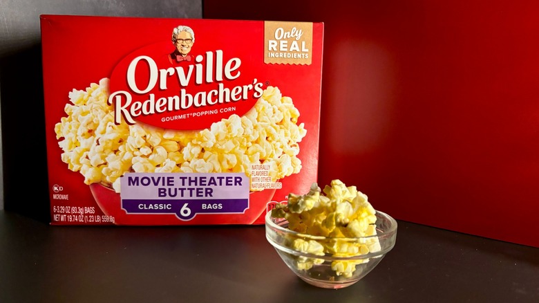 Orville Redenbacher's popcorn box with popcorn in clear ramekin